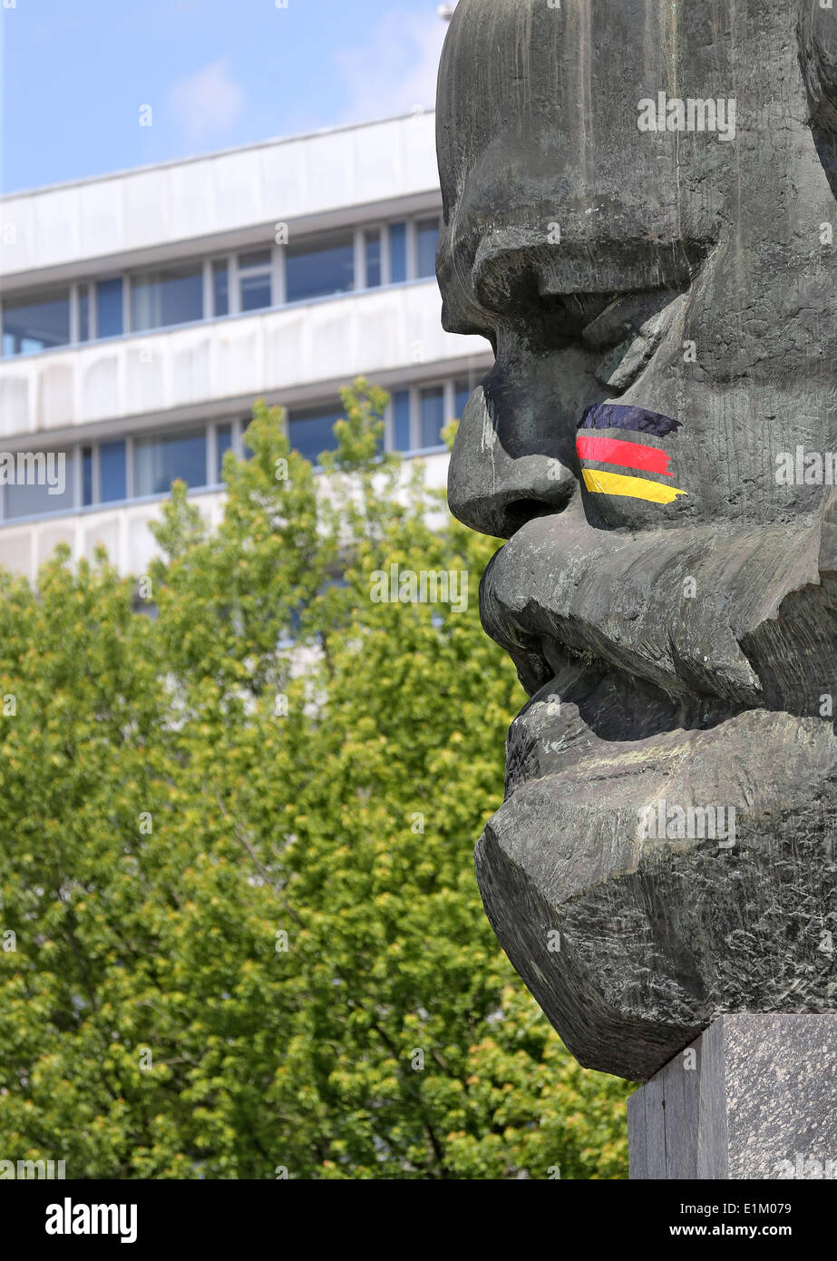 Black-red-gold stripes adorn the face of Karl Marx at the Marx Monument in  Chemnizt, Germany, 06 June 2014. A special company decorated the statue as  a football fan for the World Cup.