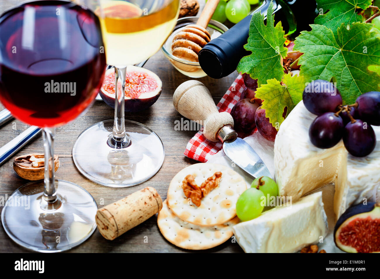 Wine, grape and cheese on wooden background Stock Photo