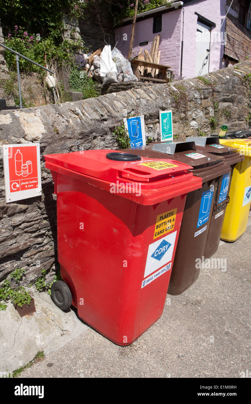 Coloured Recycling Bins in quayside in the cornish seaside village of  Mevagissey Stock Photo