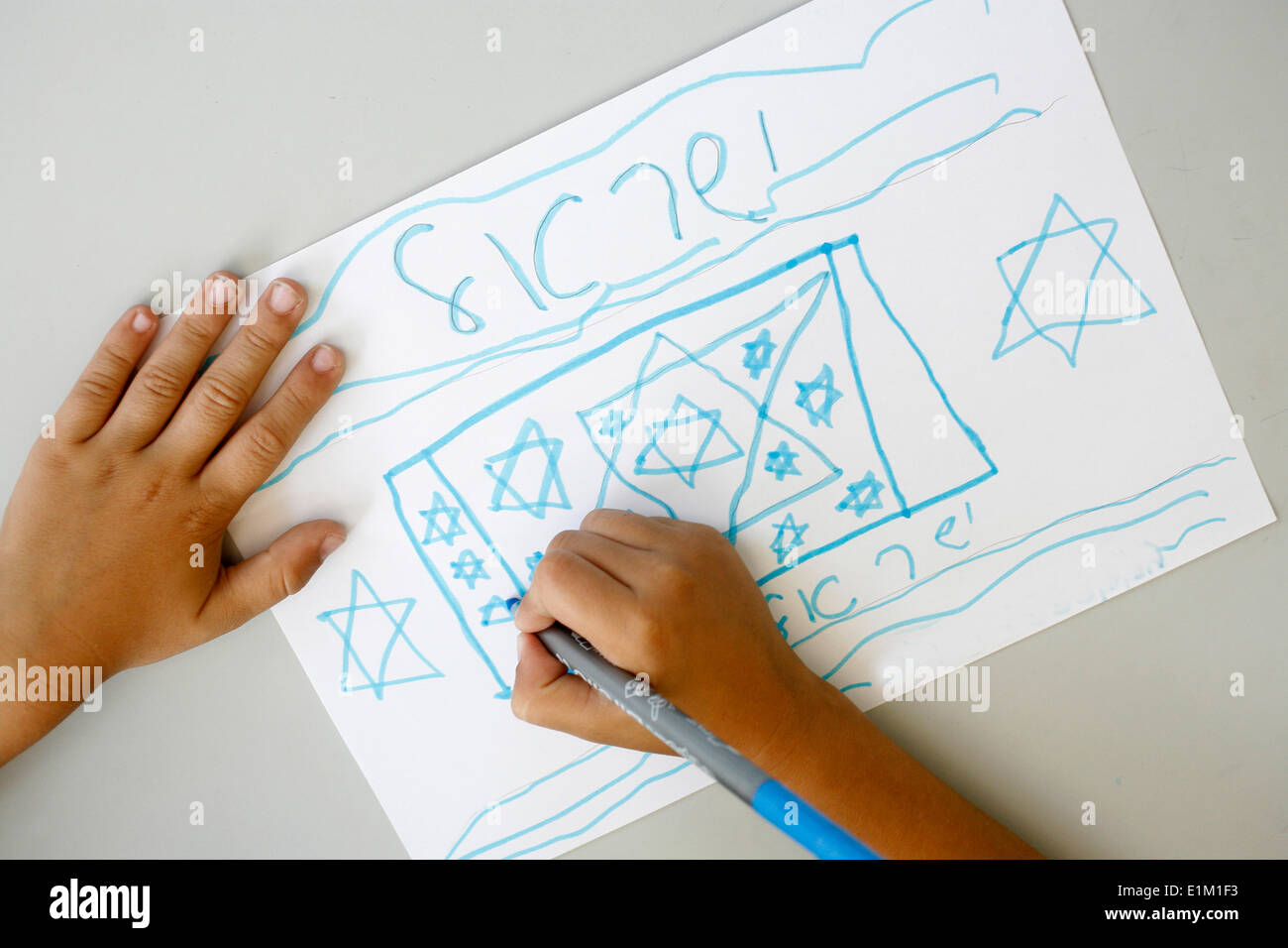 Boy drawing an Israeli flag Stock Photo