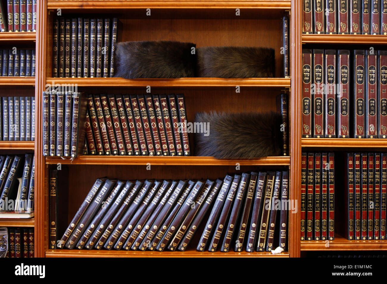 Shtreimel hats and books in the Belz synagogue, Jerusalem Stock Photo
