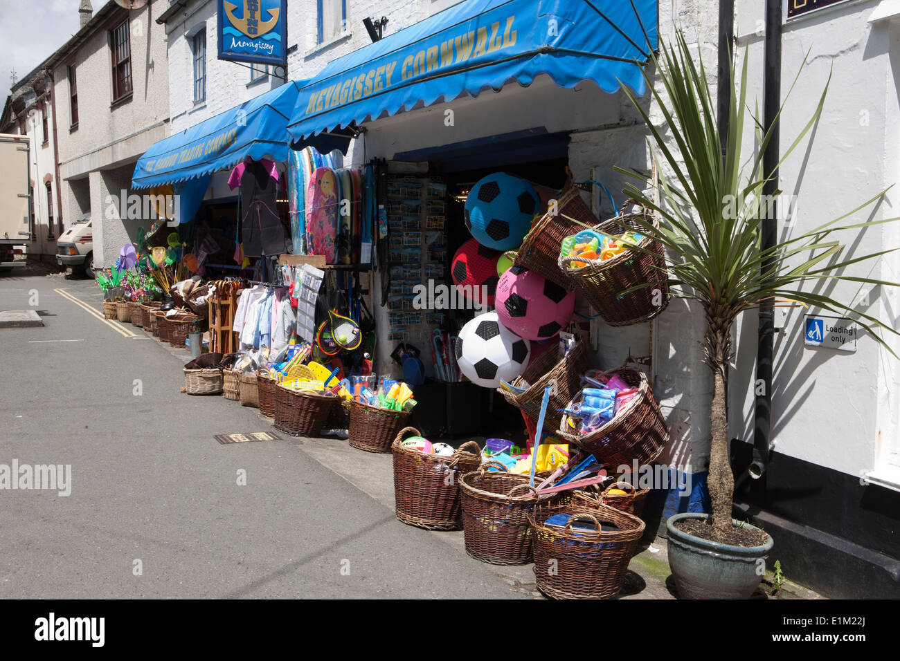 Goods on the pavement out side a tourist gifts shop in the cornish seaside town of Mevagissey Stock Photo