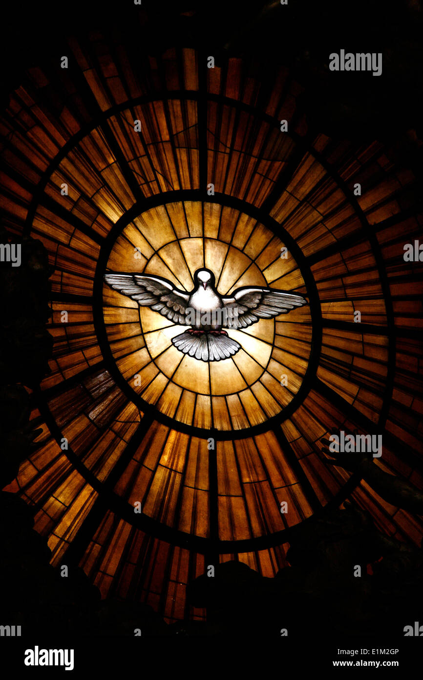 Stained glass window  in St Peter's basilica : Holy spirit dove symbol Stock Photo
