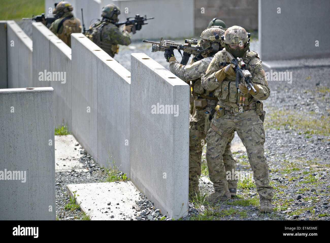 Special operation forces from nine different nations participate in the International Special Training Center advanced close quarter battle course at the 7th Army Joint Multinational Training Command June 5, 2014 at Grafenwoehr Training Area, Germany. Stock Photo