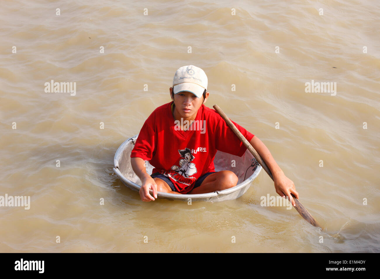 Young boy  on  Tonle Sap Lake. Stock Photo