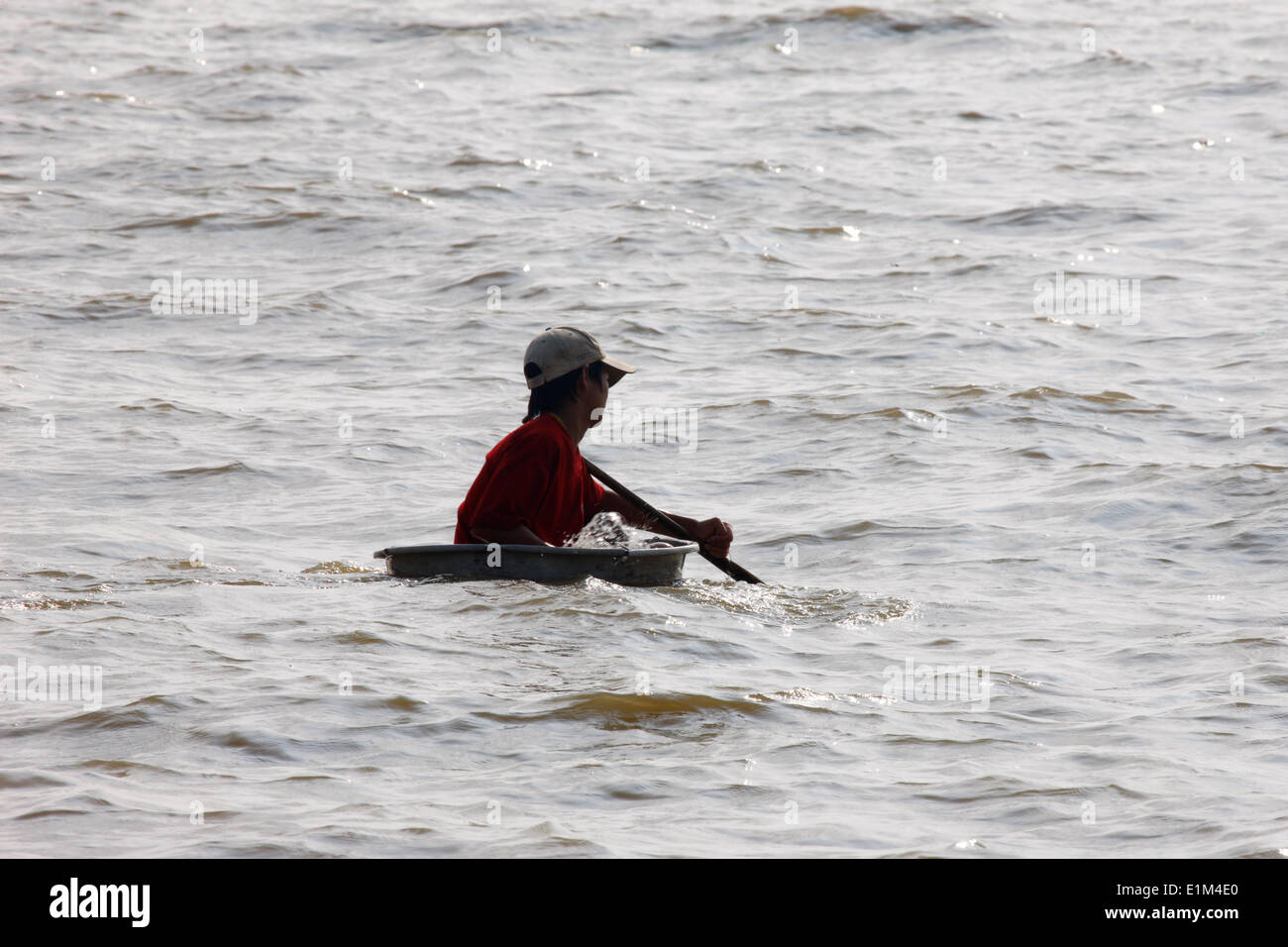 Young boy  on  Tonle Sap Lake. Stock Photo