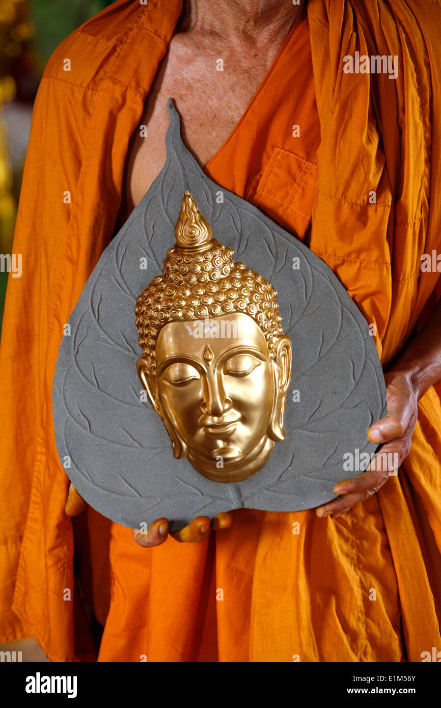 Buddhist monk visiting a Buddha statue shop Stock Photo Alamy