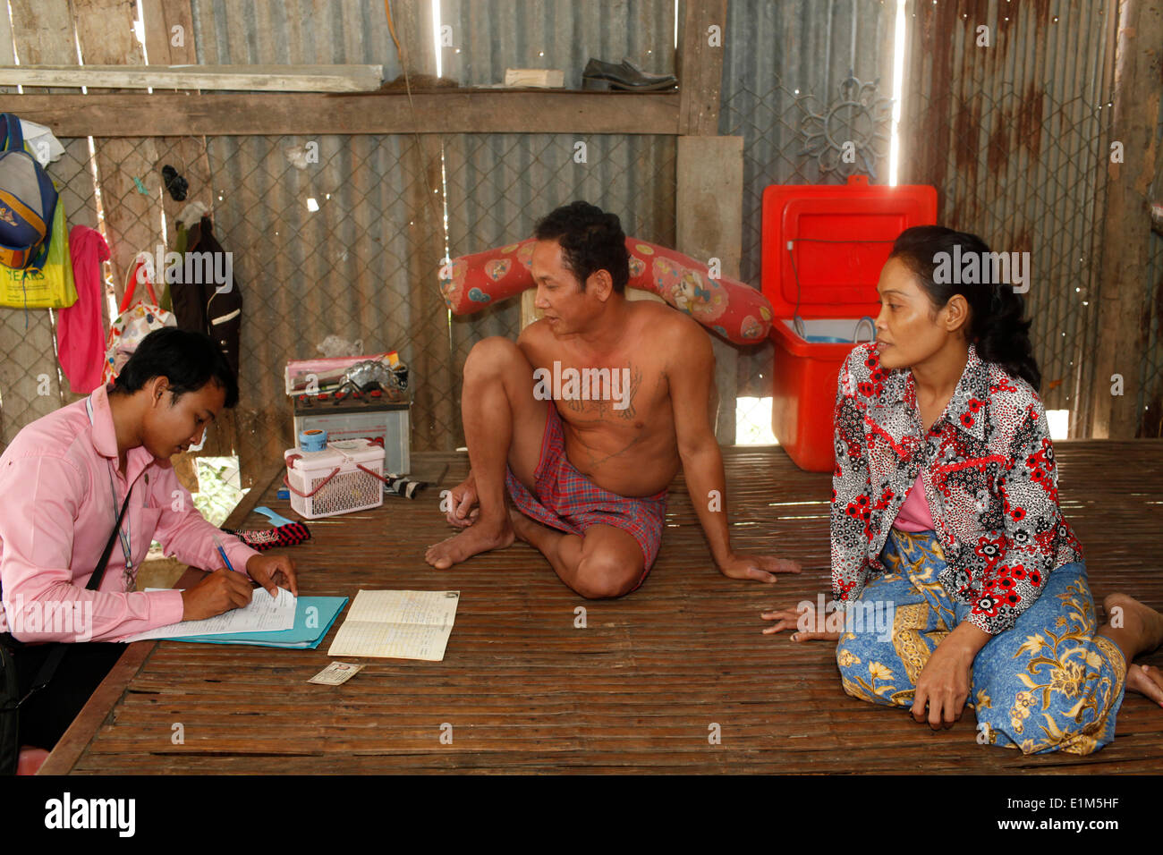 Chamroeun microfinance loan officer Chin Sokreth at a client's home Stock Photo