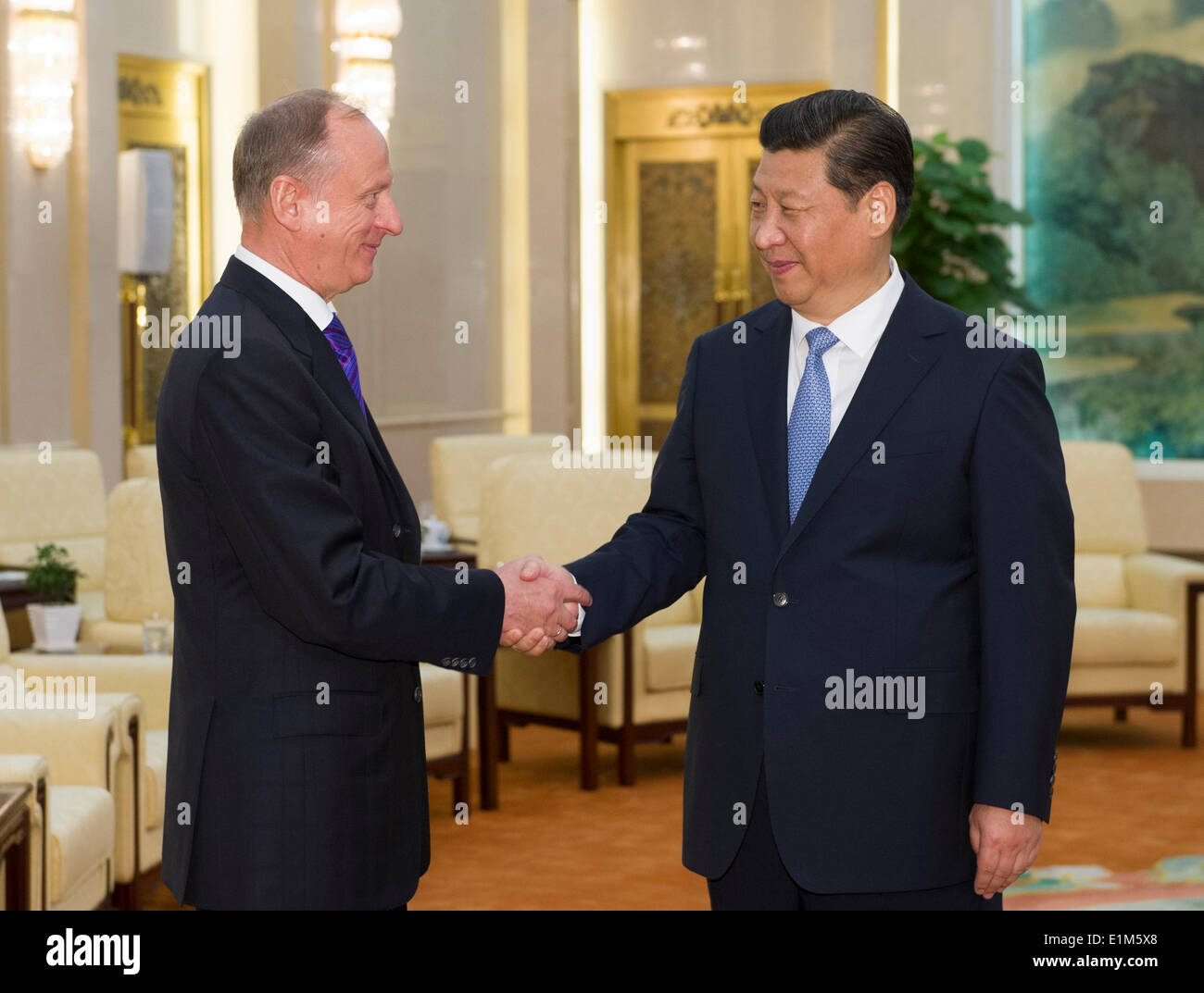 Beijing, China. 6th June, 2014. Chinese President Xi Jinping (R) meets with Russian Security Council Secretary Nikolai Patrushev in Beijing, capital of China, June 6, 2014. Nikolai Patrushev was here to attend the first meeting of China-Russia institutionalized cooperation in law enforcement and security and the 10th round of China-Russia strategic security consultation. © Xie Huanchi/Xinhua/Alamy Live News Stock Photo