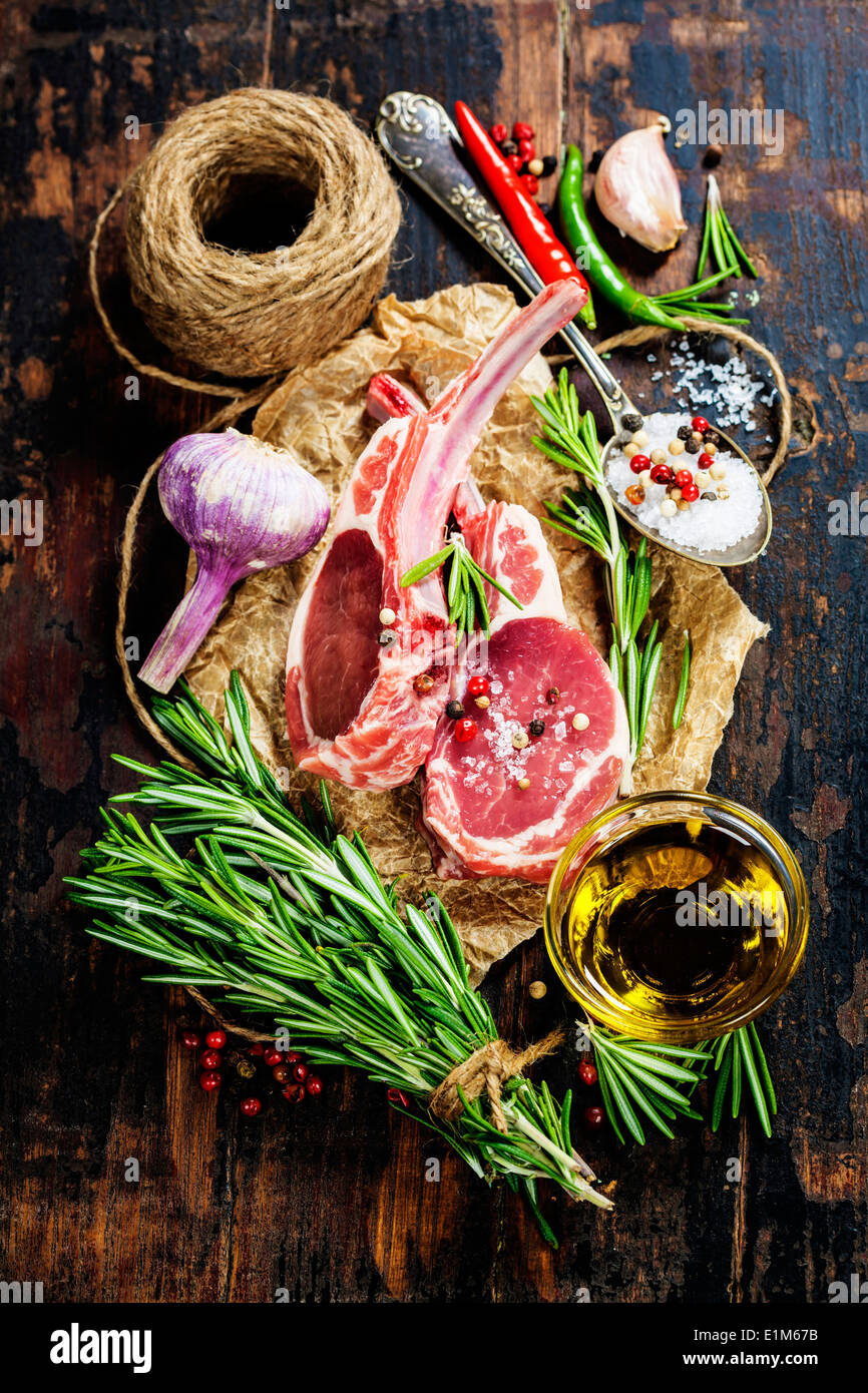 Raw lamb cutlets with vegetables, herbs and spices Stock Photo