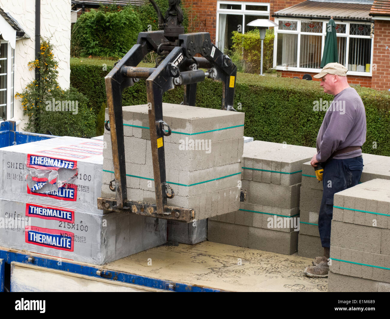 self building house, delivery of concrete blocks being lifted from builder’s merchant’s lorry Stock Photo