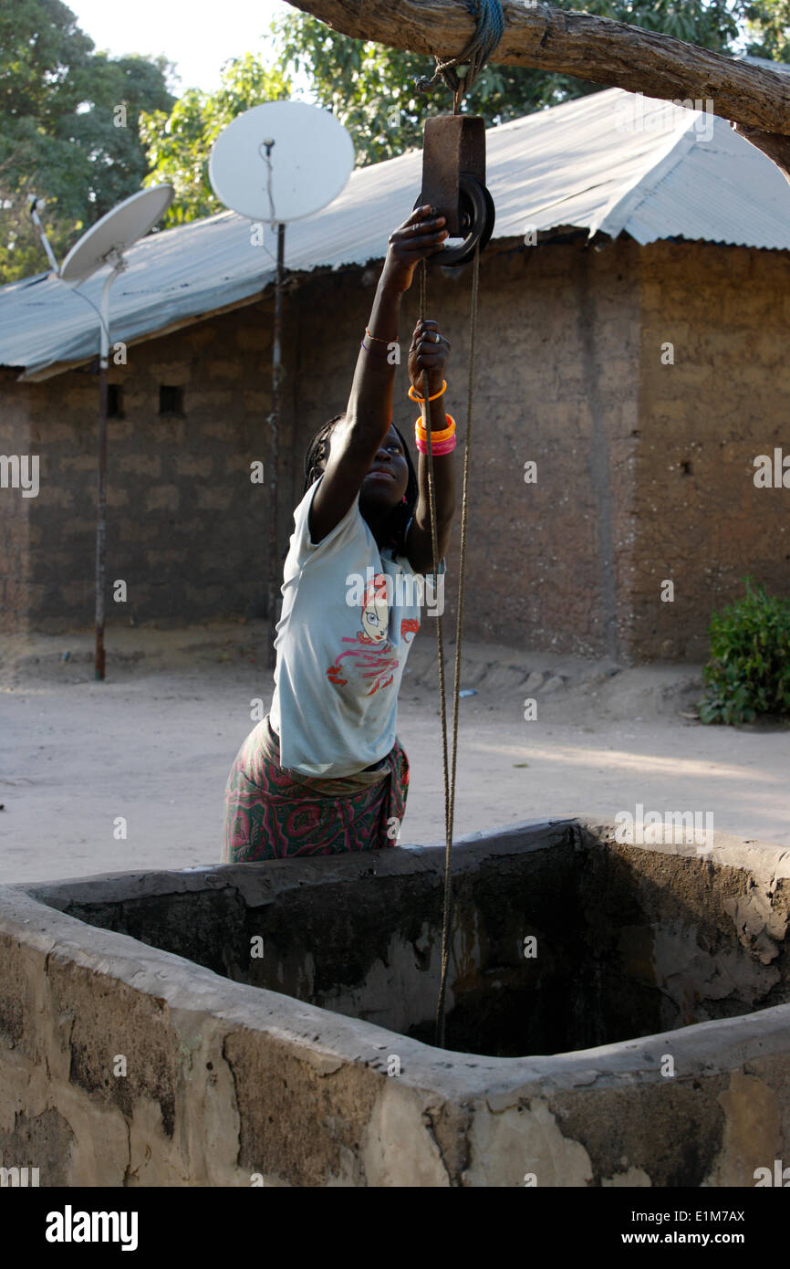 Girl fetching water from a well Stock Photo Alamy