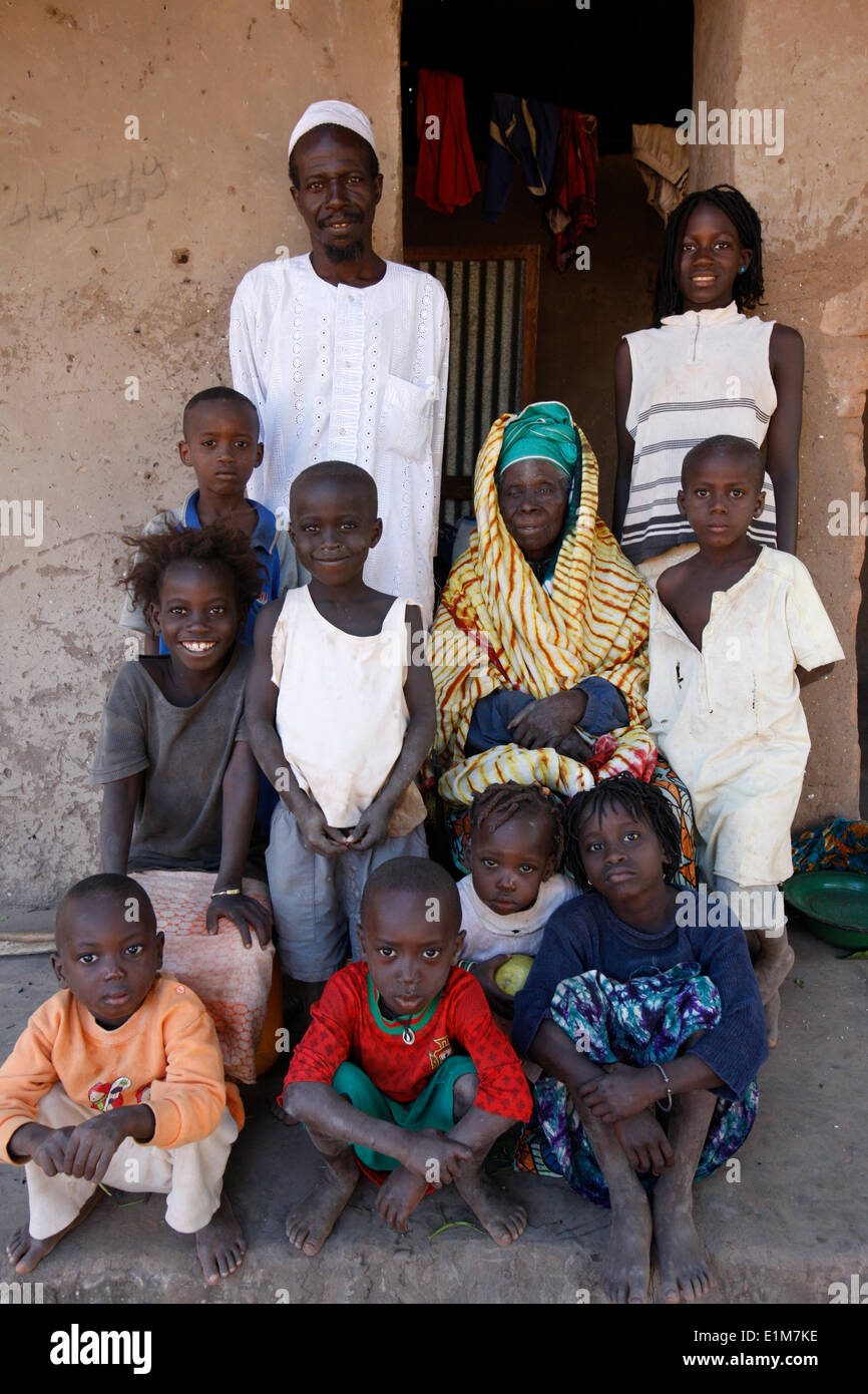 Family outside their home Stock Photo