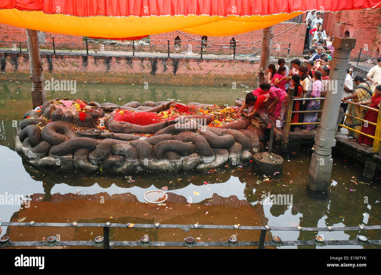 Vishnu lying on a Naja snake bed at Buddha Nilkantha shrine Stock Photo