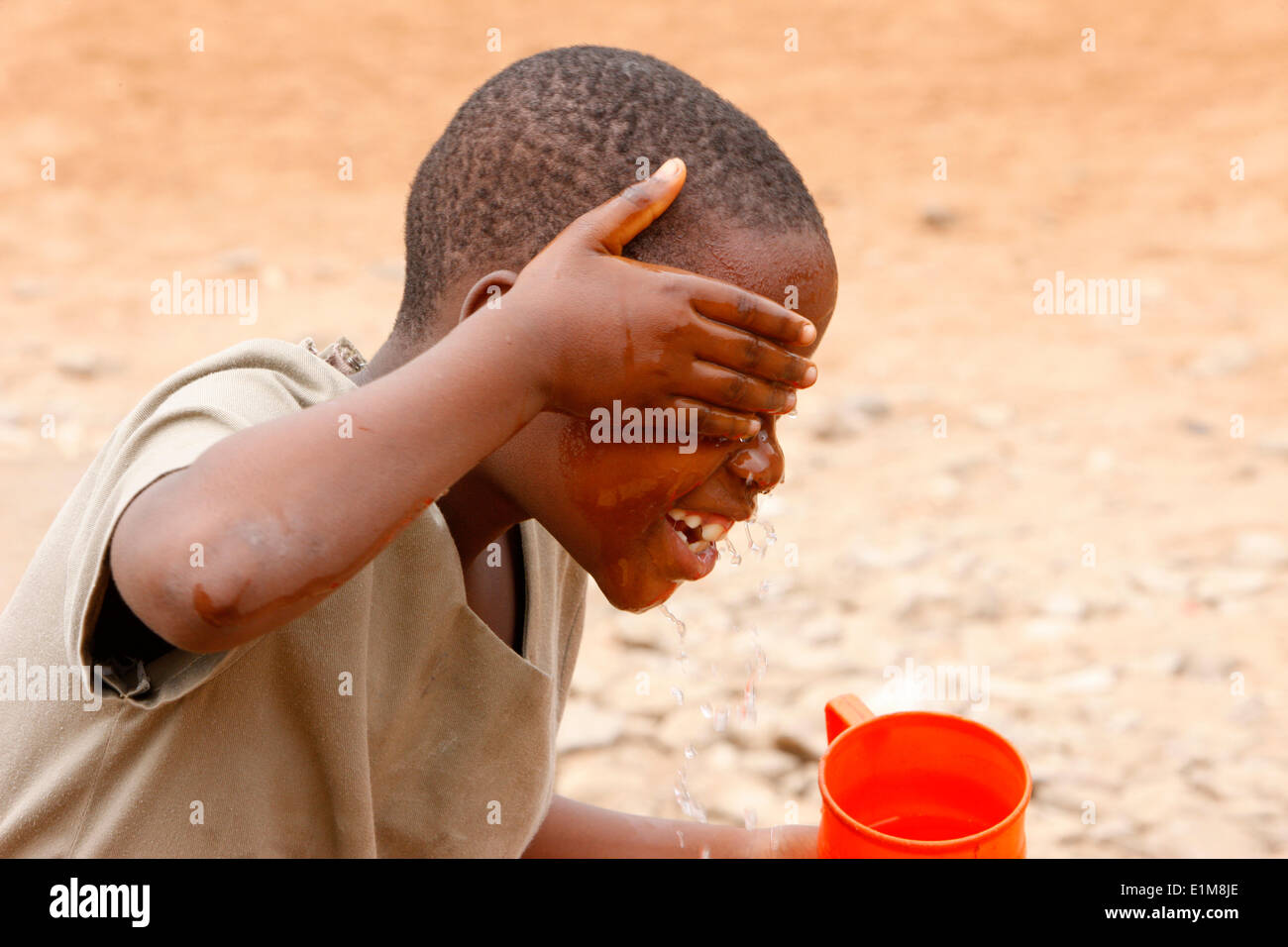 Boy washing his face Stock Photo Alamy