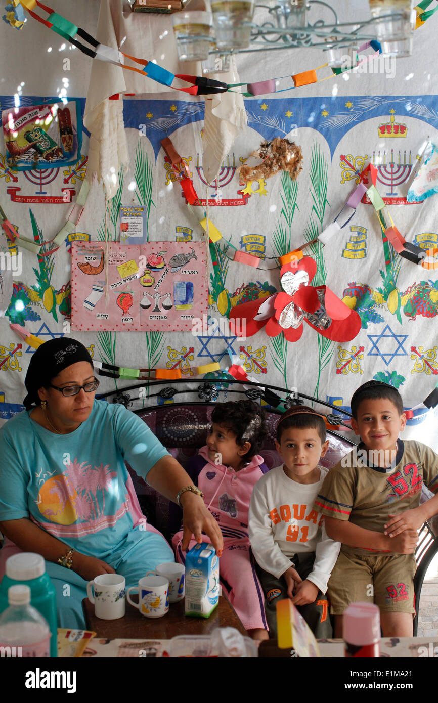 Jewish family living in a succa during succot holiday Stock Photo