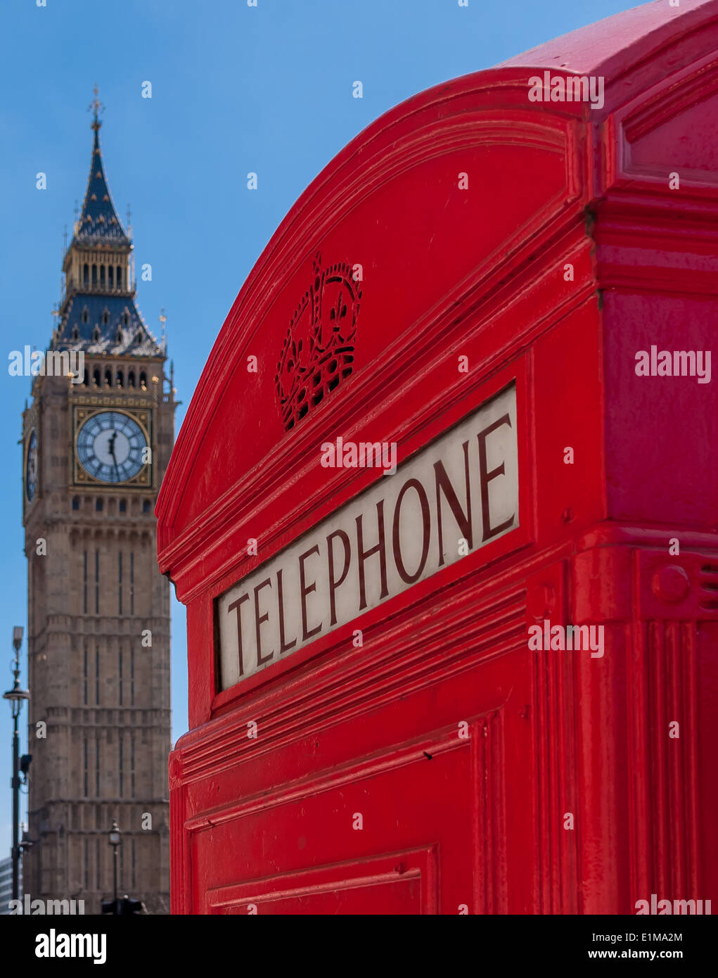 A telephone box with the Elizabeth Tower in the background. Stock Photo