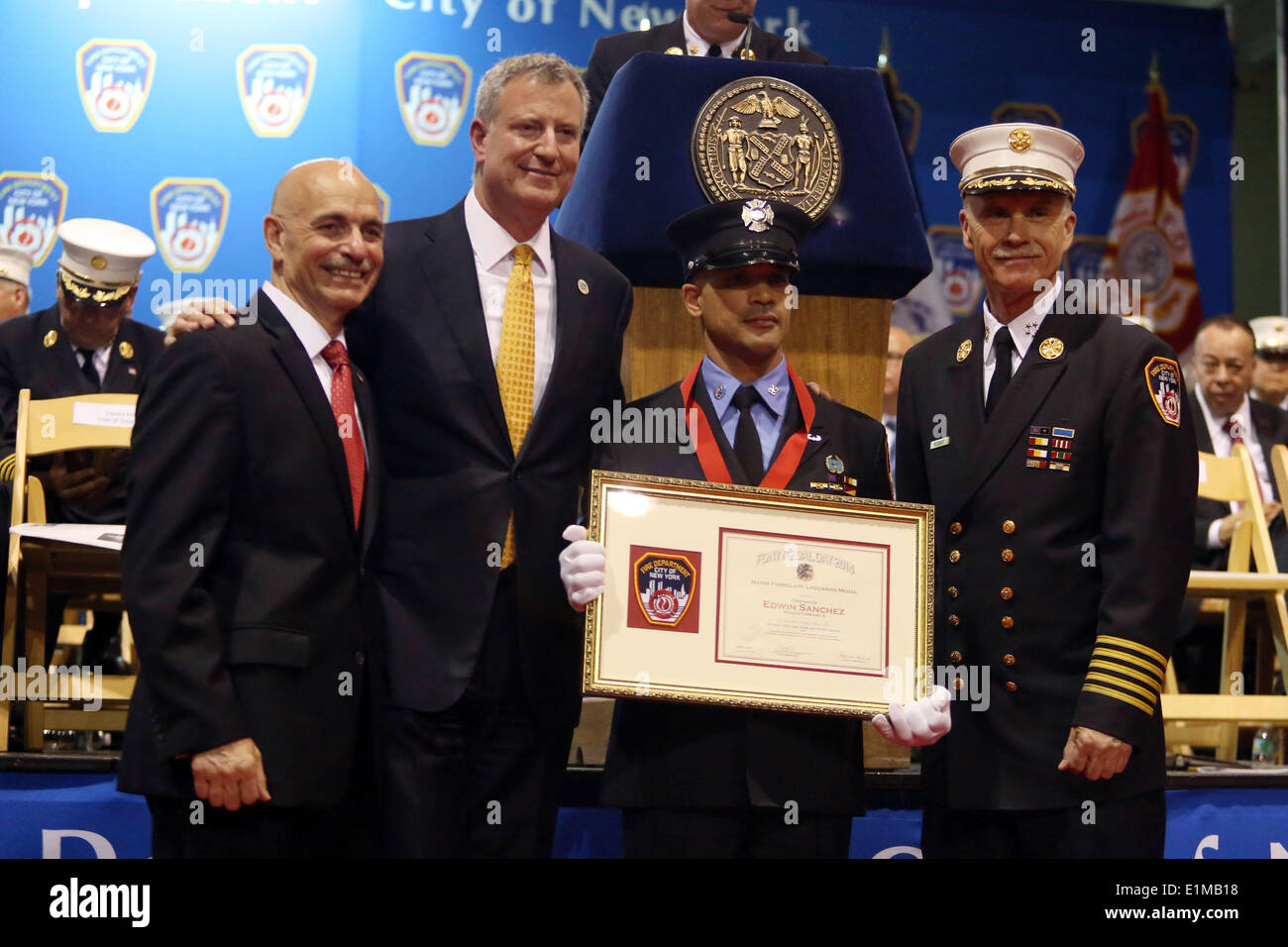 New York, New York, USA. 4th June, 2014. Firefighter EDWIN SANCHEZ of Rescue Company 4 is awarded the Mayor Fiorello H. LaGuardia Medal during FDNY Medal Day 2014 at the 69th Regiment Armory in New York City, New York. © Krista Kennell/ZUMAPRESS.com/Alamy Live News Stock Photo