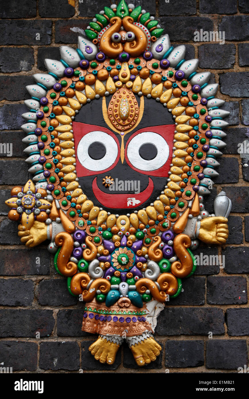 Hindu god Jagannath sculpture on a wall in Brick Lane Stock Photo