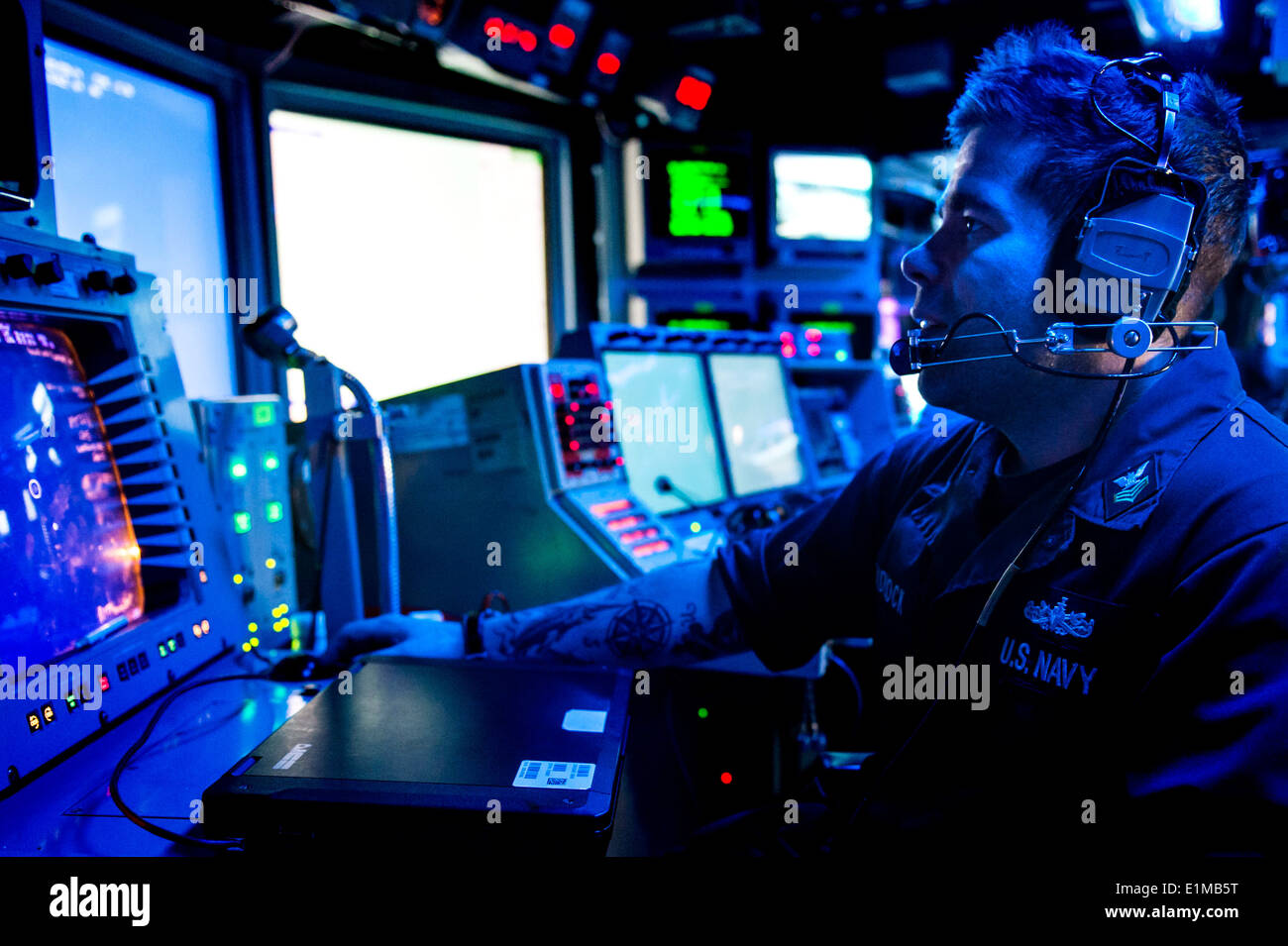 U.S. Navy Fire Controlman 1st Class Aaron Tadlock monitors a radar