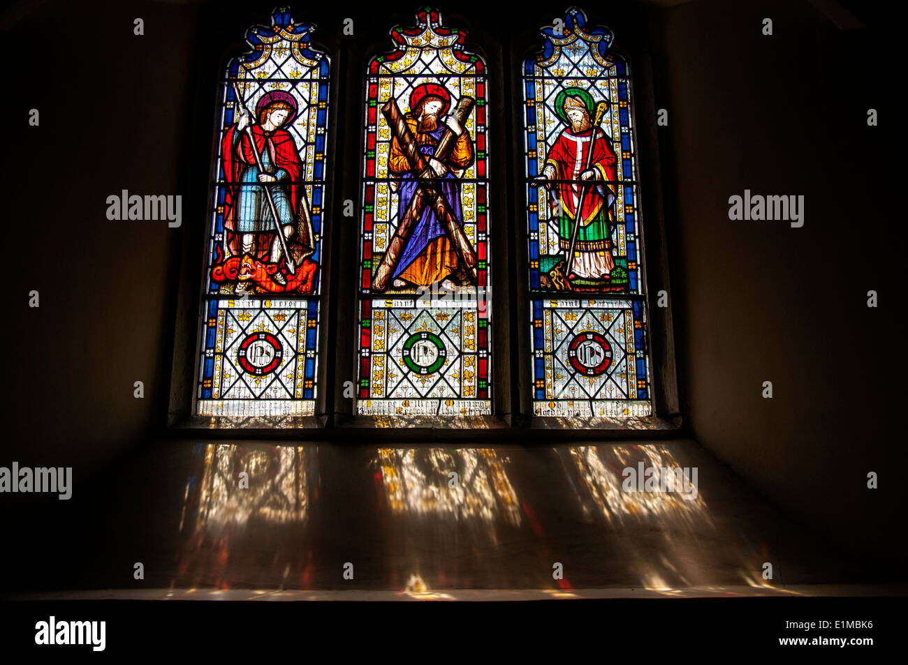Stained glass windows and sunlight reflections in St Saint Petroc Stock