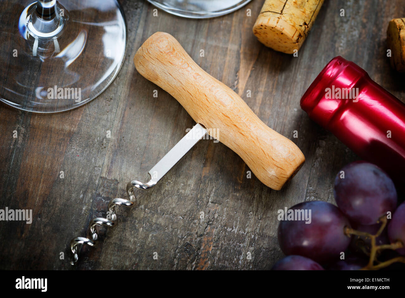 Wine,grape, glasses and corkscrew on wooden background Stock Photo