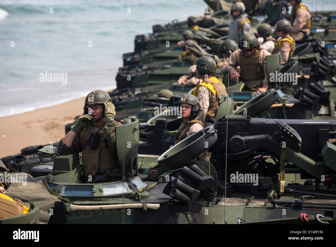 U.S. Marines with the 2nd Battalion, 3rd Marine Regiment, attached to the 4th Marine Regiment, line up in assault amphibious ve Stock Photo