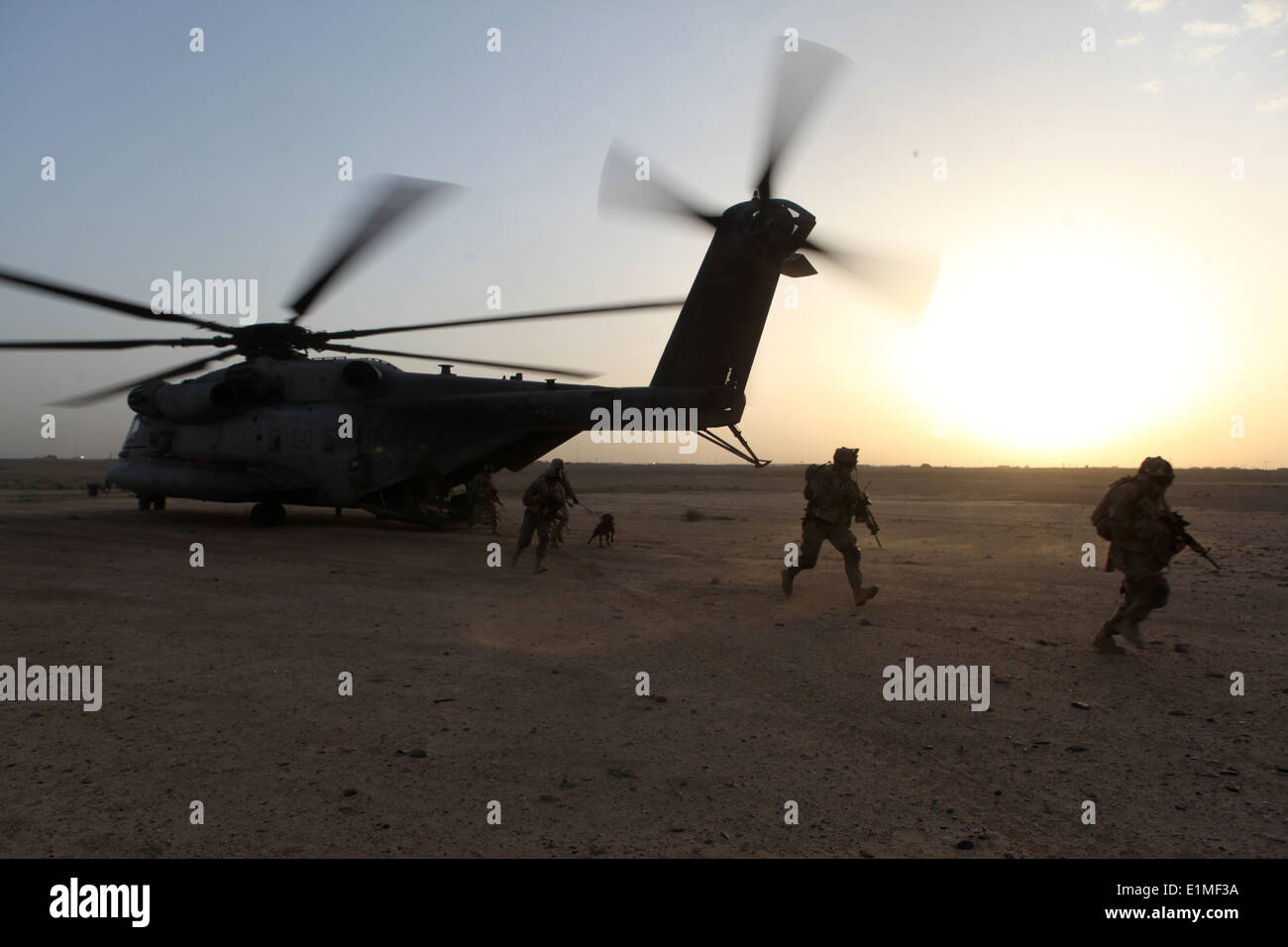 U.S. Marines assigned to a Georgian Liaison Team and Georgian soldiers exit a Marine Corps CH-53E Super Stallion helicopter as Stock Photo