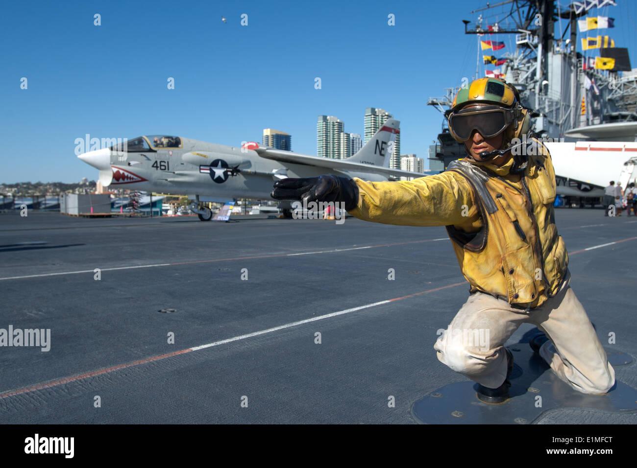 A mannequin is posed to depict a Sailor launching an aircraft on the flight deck of the USS Midway Museum April 6, 2014, in San Stock Photo