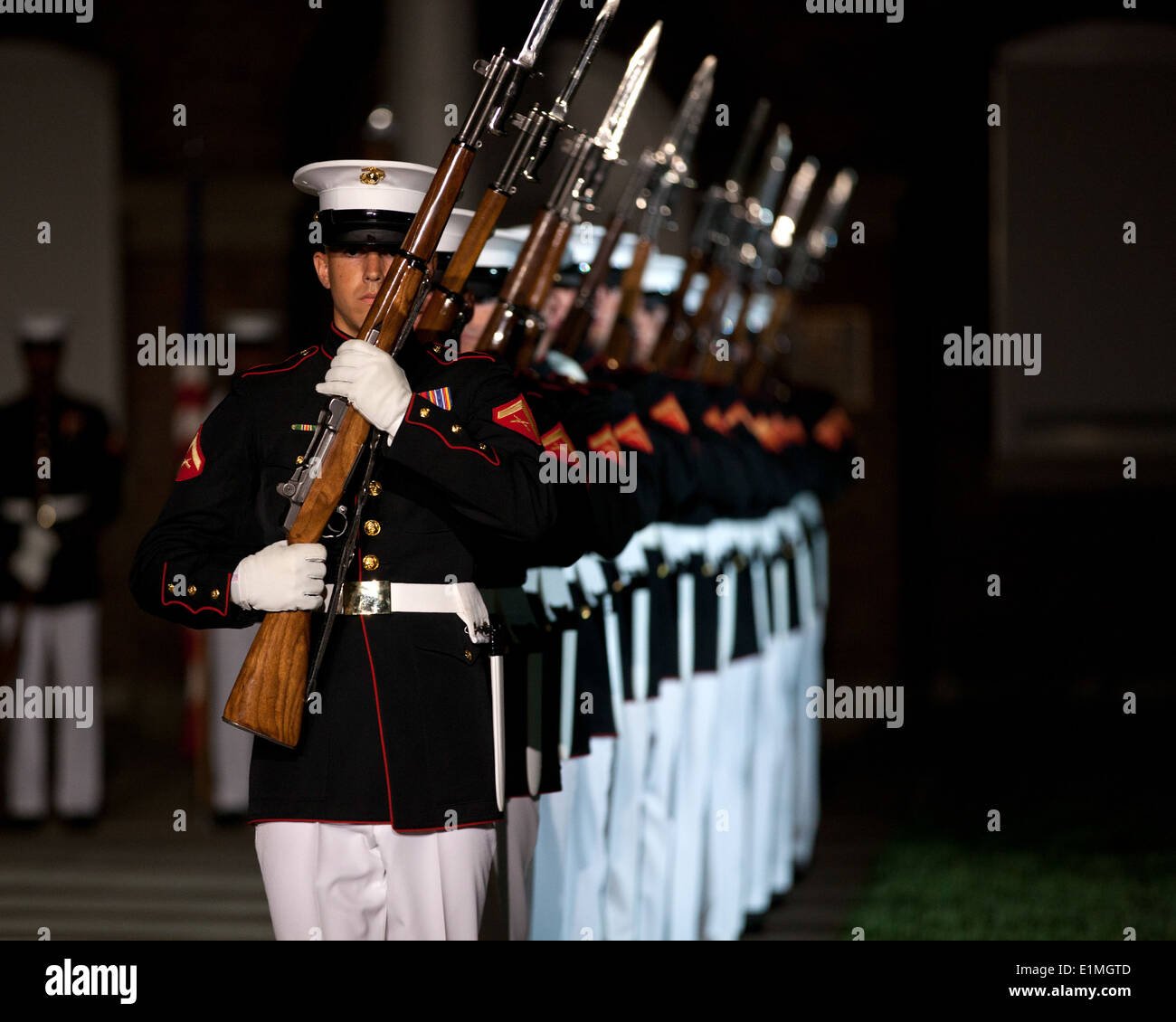 U.S. Marines with the Silent Drill Platoon perform during an Evening Parade at Marine Barracks Washington in Washington, D.C., Stock Photo