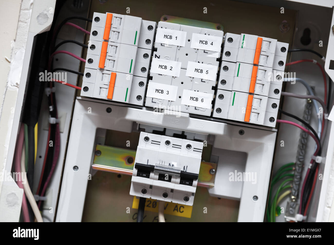Electrical panel with automatic circuit breakers and wires Stock Photo