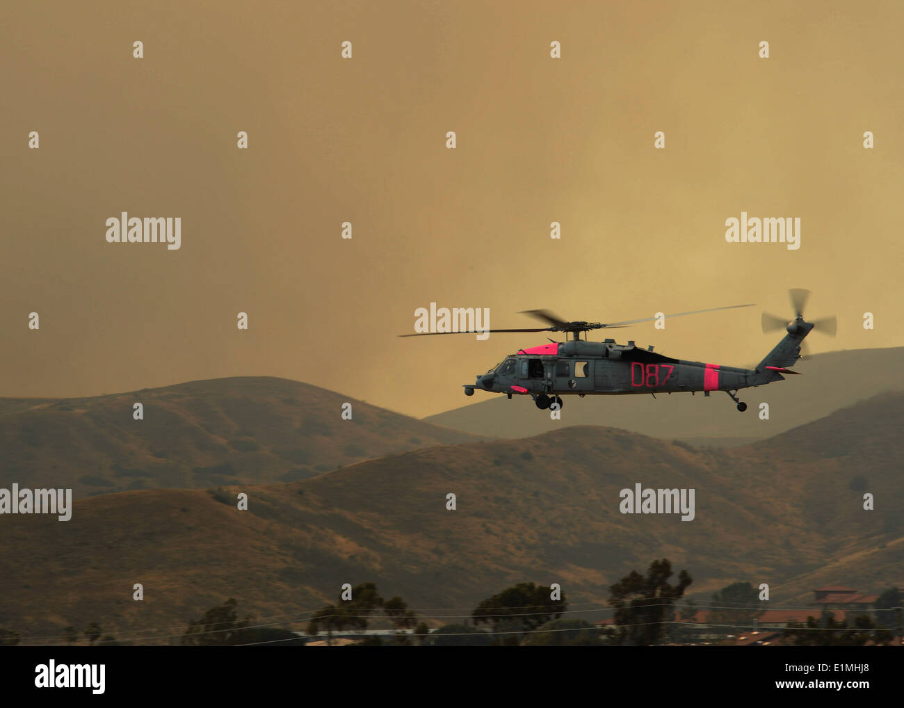 A U.S. Navy MH-60S Seahawk helicopter assigned to Helicopter Sea Combat Squadron (HSC) 3 takes off from Marine Corps Base Camp Stock Photo