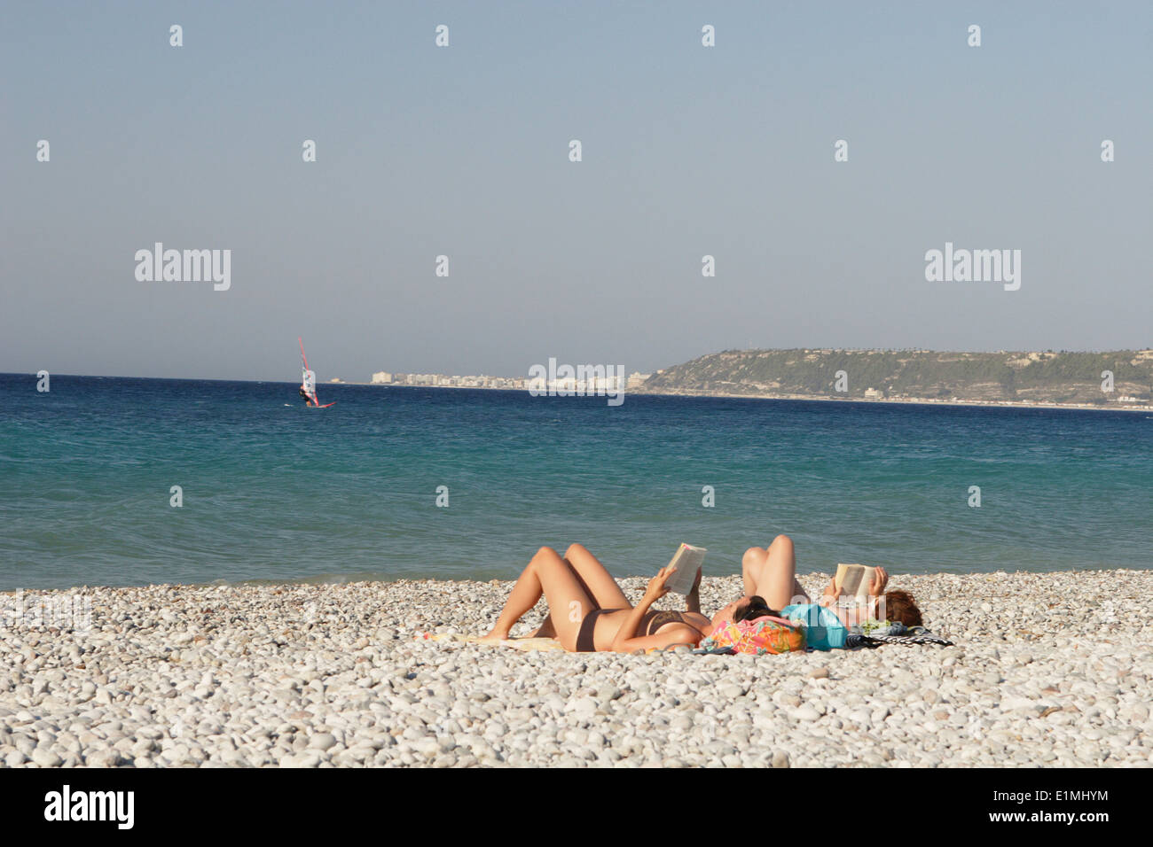 Happy couple on the beach, Ialyssos Bay, Rhodes Island, Greece Stock Photo