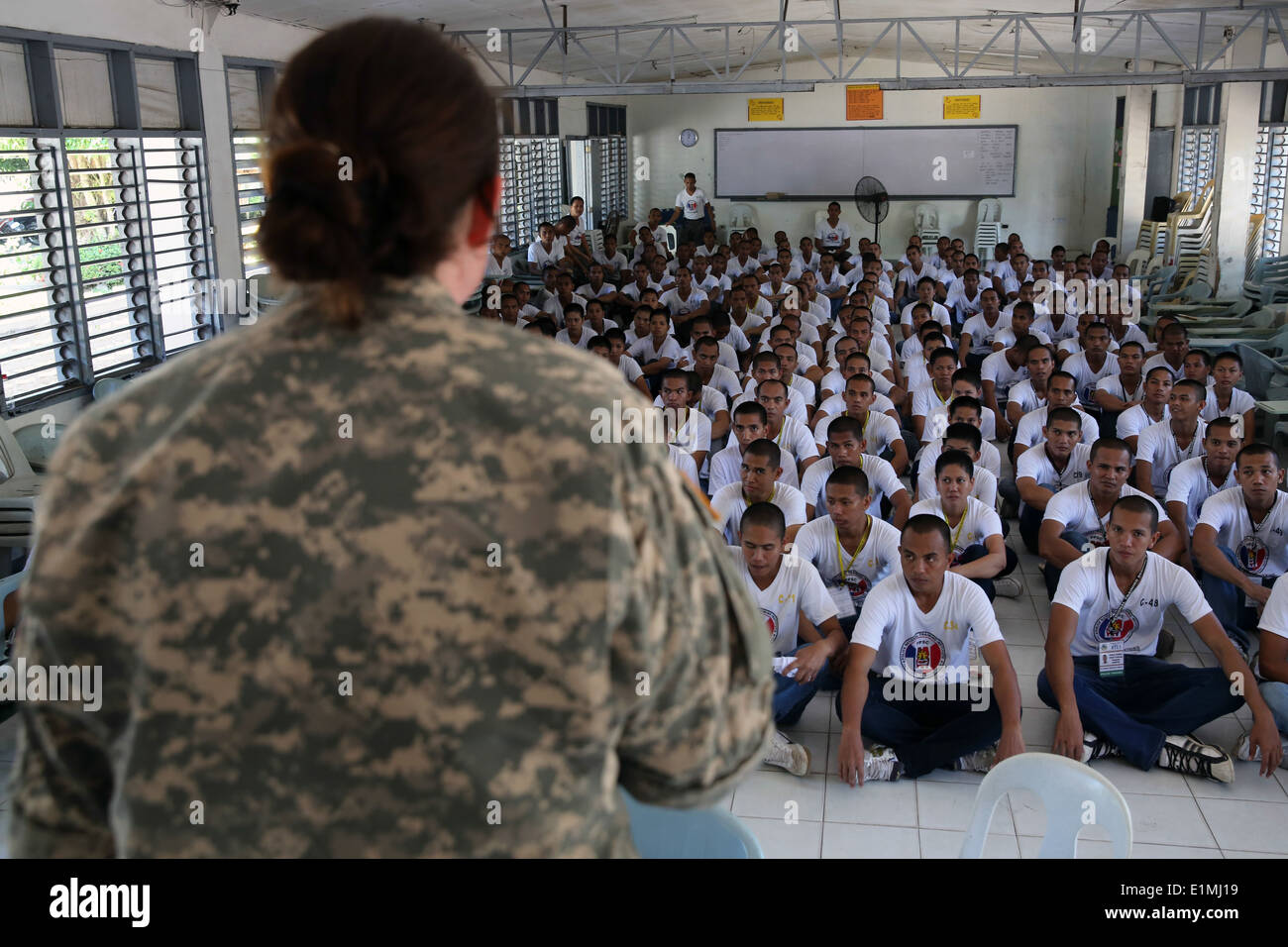 U.S. Army Maj. Kate Flocke, left, the Joint Civil Military Operations Task Force battalion surgeon with the 97th Civil Affairs Stock Photo