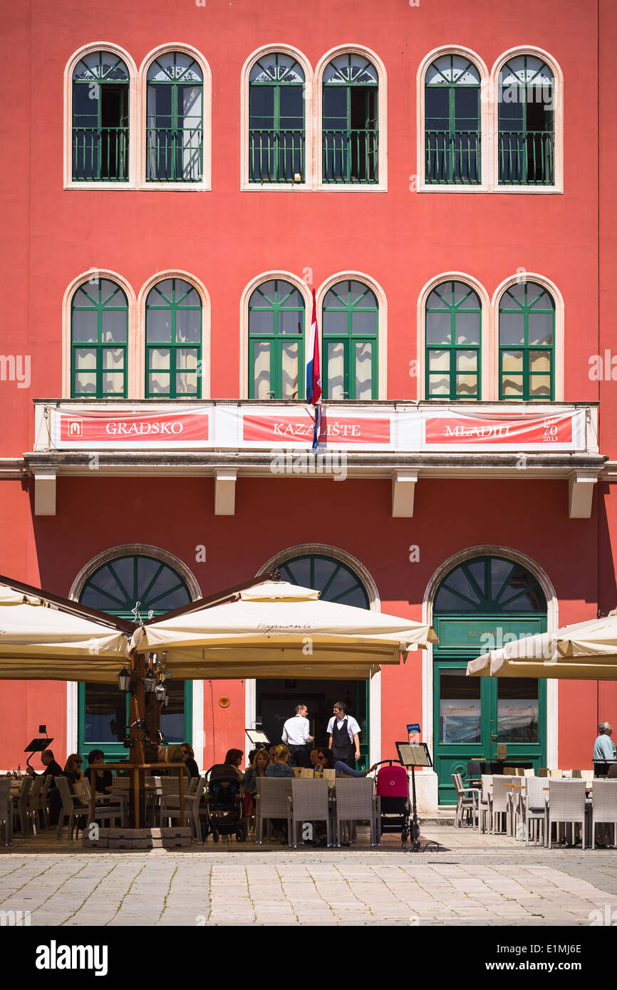 View of the Prokurative or Republic Square (Trg Republike) in Split Croatia as the restaurant begins to fill Stock Photo