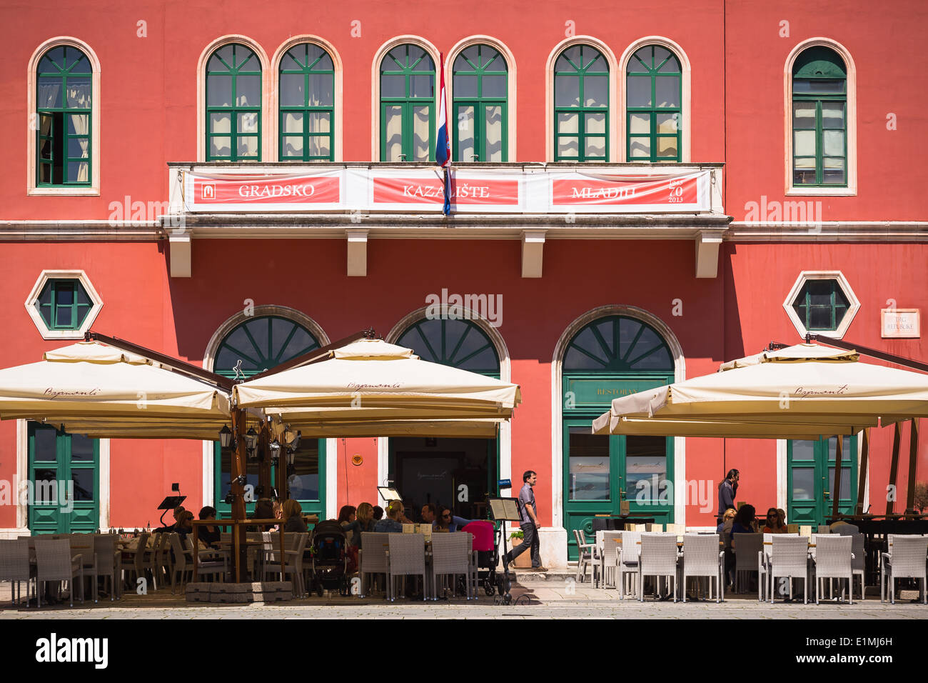View of the Prokurative or Republic Square (Trg Republike) in Split Croatia as the restaurant begins to fill Stock Photo