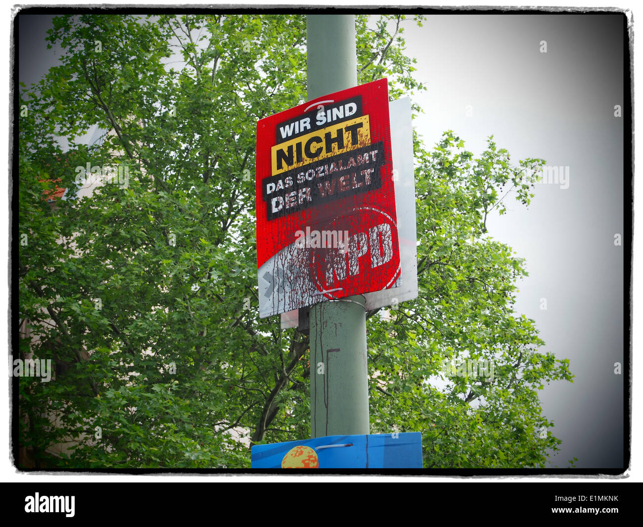 An election poster for the radical German rightwingers party NPD (German Nationaldemocratic Paty) full of brown color is pictured in Berlin ahead of the European elections, on May 17, 2014. Photo: Wolfram Steinberg dpa Stock Photo