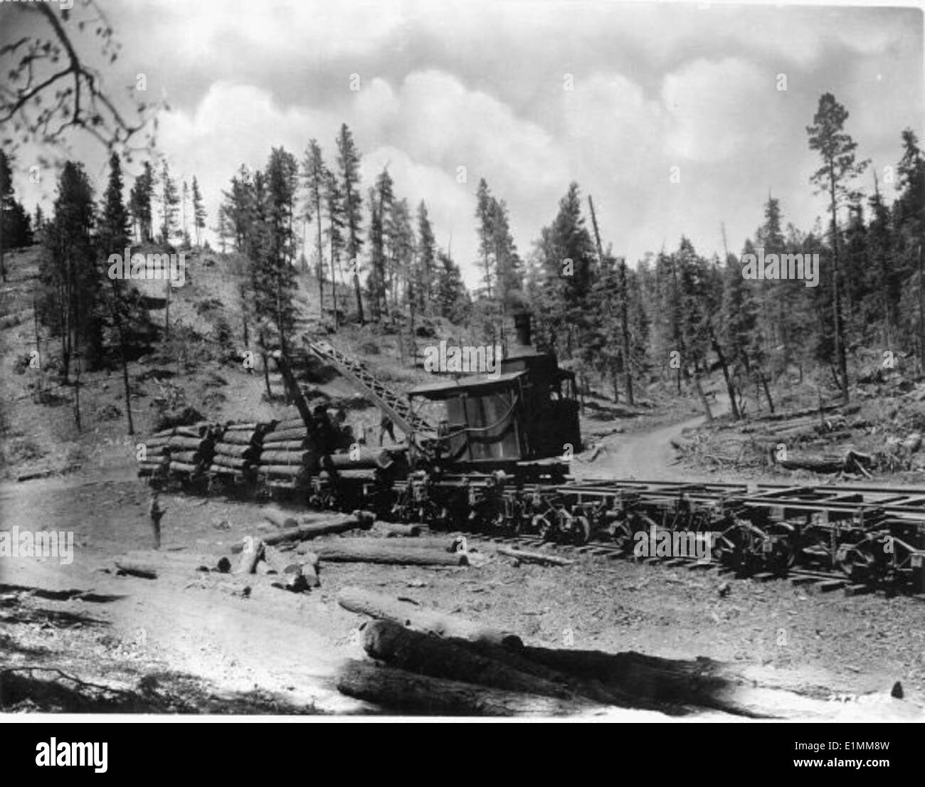 A black-and-white photo depicting the historic use of Lincoln logs by ...