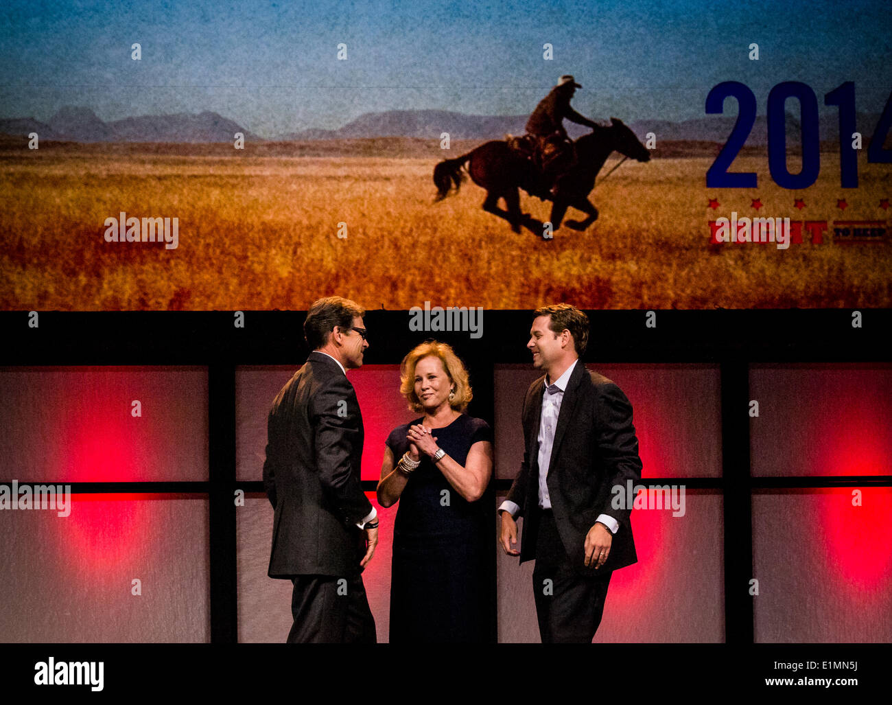 Ft, Worth, USA - 5 June 2014 - Republican GOP party state meeting hears Gov. Rick Perry tell how the nation needs to follow Texas as an example, greated at end by his wife, Anita T. Perry and Texas GOP chairman Steve Munisteri Credit:  J. G. Domke/Alamy Live News Stock Photo