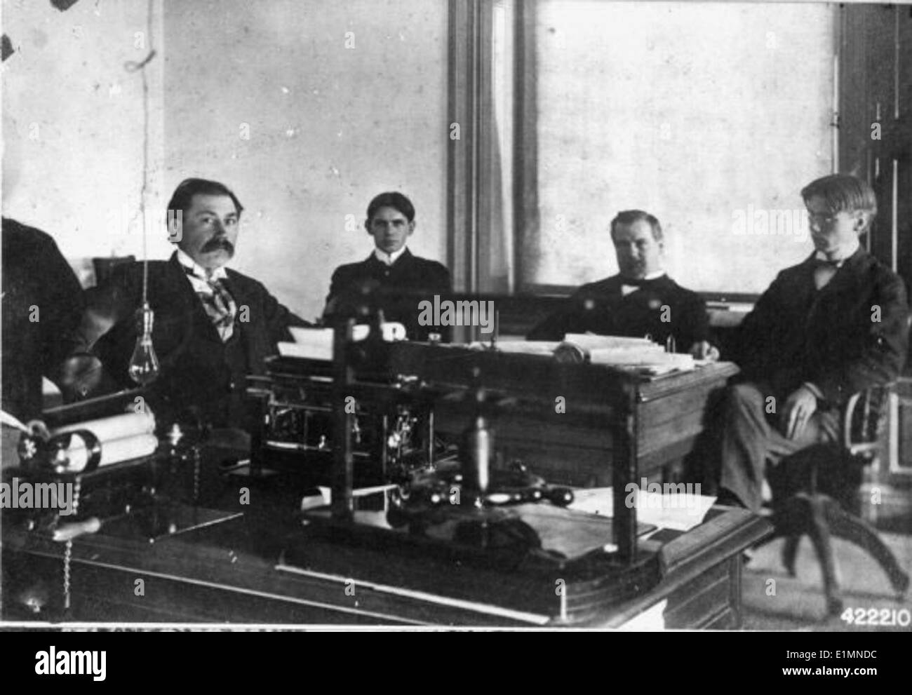 A historical black-and-white photo capturing forest rangers and other ...