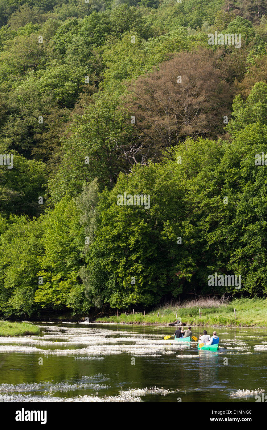 Tourists in canoes on the Semois river in the neighborhood of Mortehan in Belgium Stock Photo