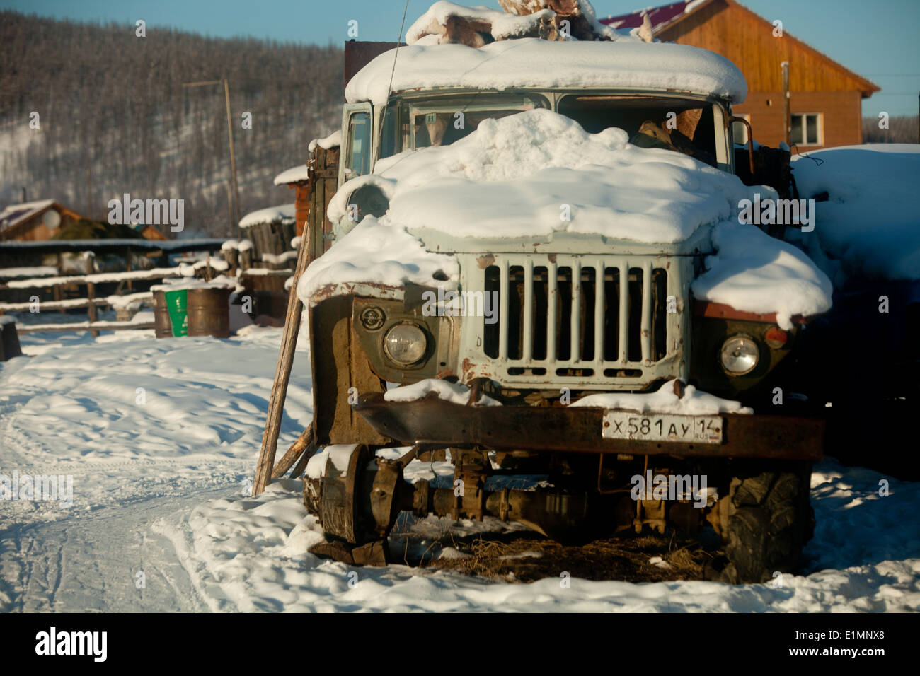 snow covered rusty truck russia siberia broken Stock Photo