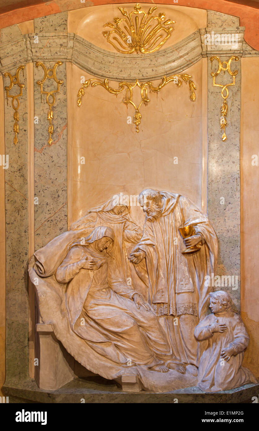 Vienna - Relief from side chapel of st. John the Nepomuk in baroque st. Annes church. Eucharist giving. Stock Photo