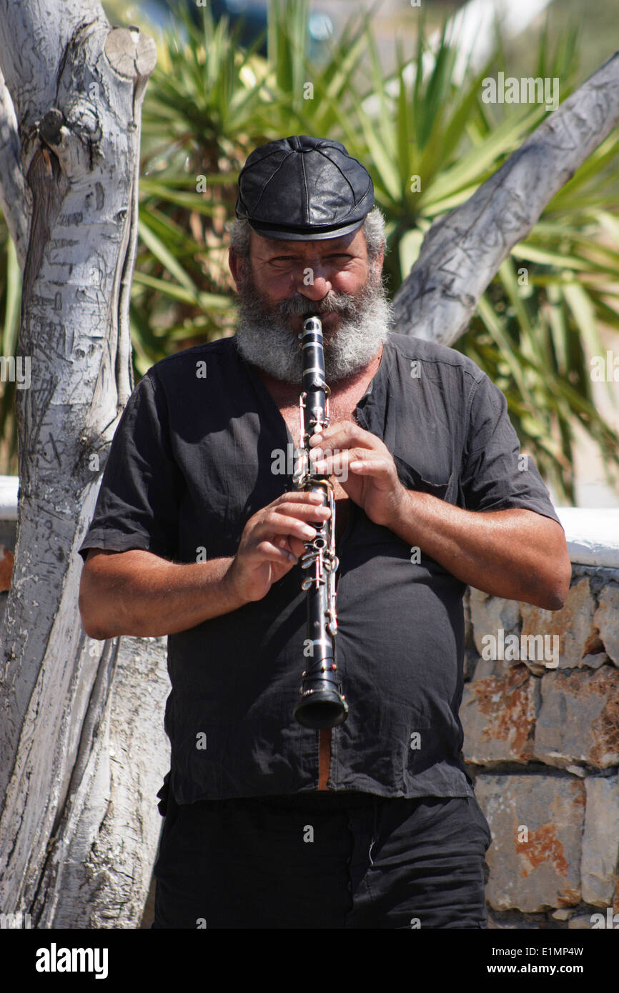 Greek man playing the flute, Rhodes Island, Pefki, Greece Stock Photo