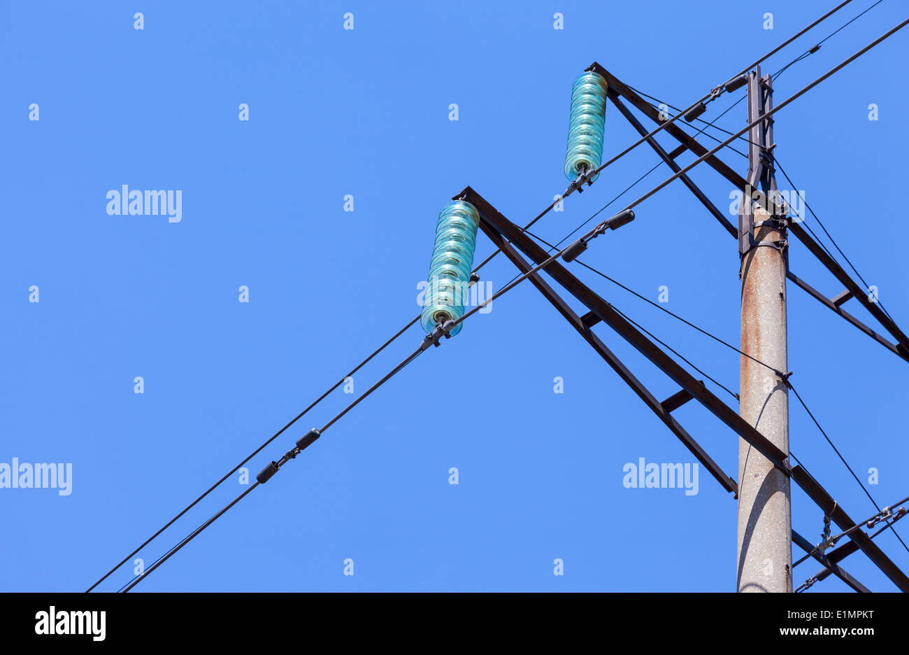 High voltage electric tower against blue sky Stock Photo - Alamy