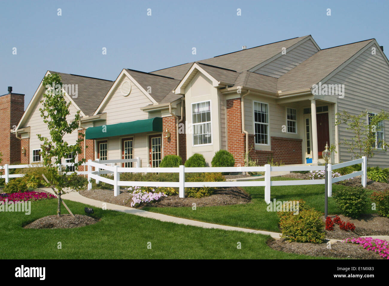 Condo with white fence. Beavercreek, Dayton, Ohio, USA. Sold as Royalty Free before April 2014. Stock Photo