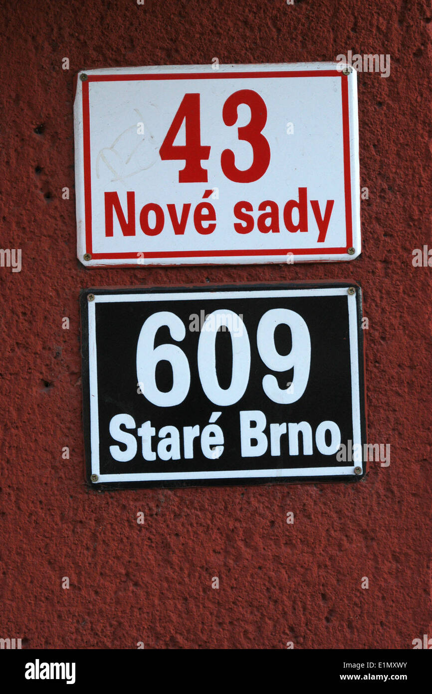 Two house numbers at Nove Sady Street in Brno, Czech Republic. Red descriptive number above, blue orientation number below. Stock Photo