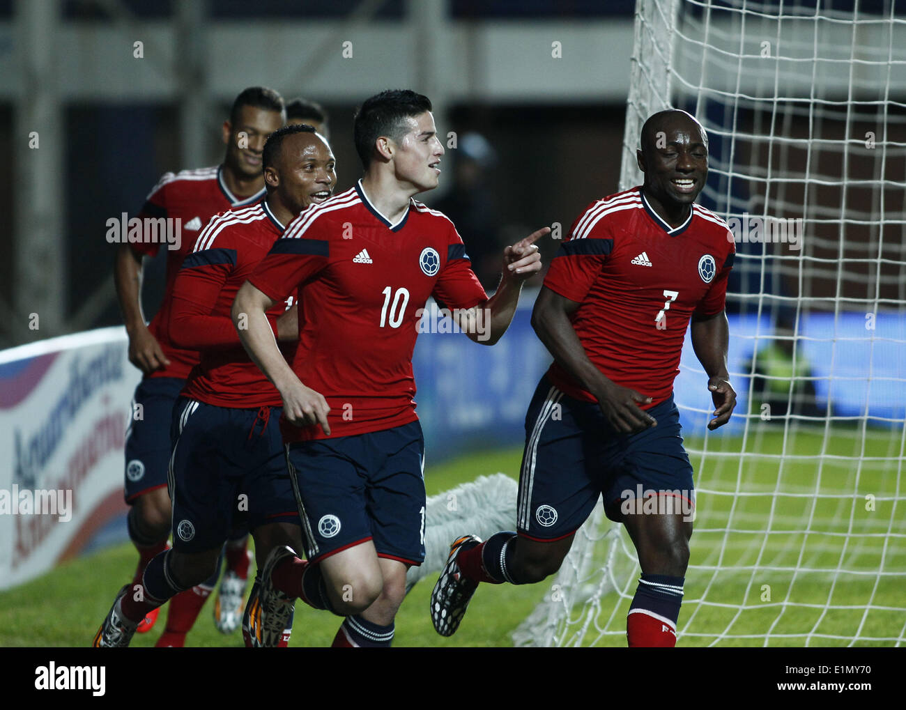 Buenos Aires, Argentina. 6th June, 2014. Colombia's James Rodriguez (2nd R) and Pablo Armero (1st R) celebrate after scoring against Jordan during the friendly match held at Pedro Bidegain Stadium in Buenos Aires City, capital of Argentina, on June 6, 2014. Colombia's national soccer team faced Jordan before their participation in the FIFA Wolrd Cup. Credit:  Santiago Pandolfi/Xinhua/Alamy Live News Stock Photo