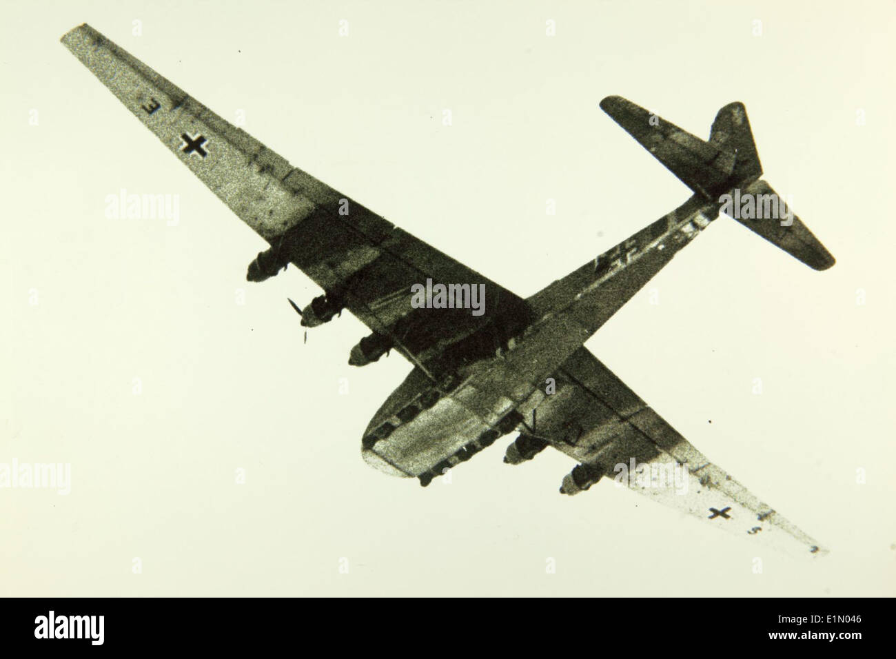 This image shows the Messerschmitt Me 323 Gigant, a large transport aircraft used by the Luftwaffe during World War II. It was designed to carry heavy loads and perform airborne troop transport missions. Stock Photo