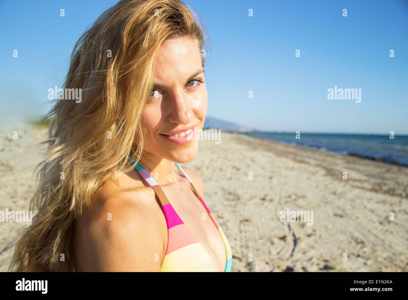 woman girl smiling happy beach summer vacation ocean sea bikini face smiling relaxed Stock Photo